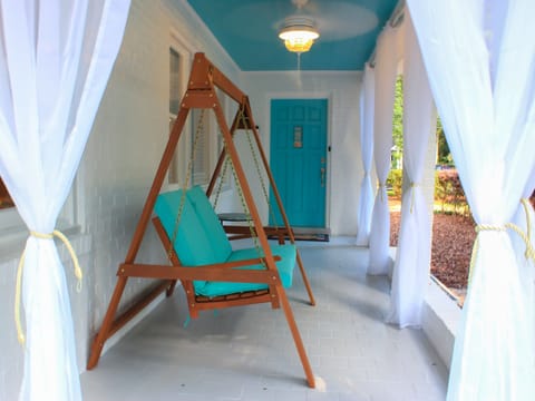 Relax with your morning cup of coffee on the relaxing front porch swing.