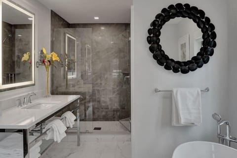 Shower, designer toiletries, hair dryer, bathrobes