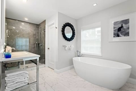 Shower, designer toiletries, hair dryer, bathrobes