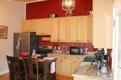 Fully stocked, eat-in kitchen. 