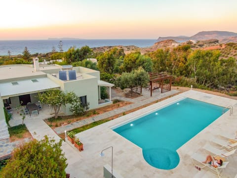 Large pool area offering sea and countryside views