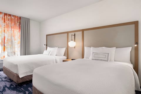 Room, 2 Queen Beds | Desk, blackout drapes, iron/ironing board, free cribs/infant beds