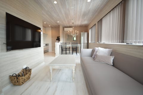 Apartment, 3 Bedrooms | Living area | Flat-screen TV