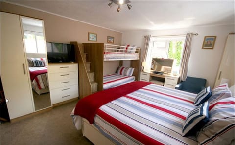 Family Quadruple Room | Hypo-allergenic bedding, laptop workspace, blackout drapes, free WiFi