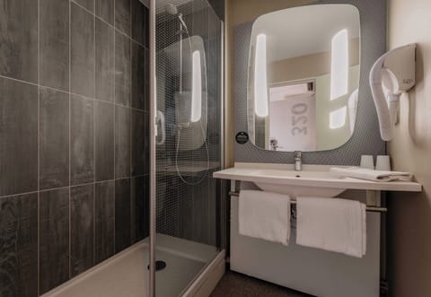 Eco-friendly toiletries, hair dryer, towels