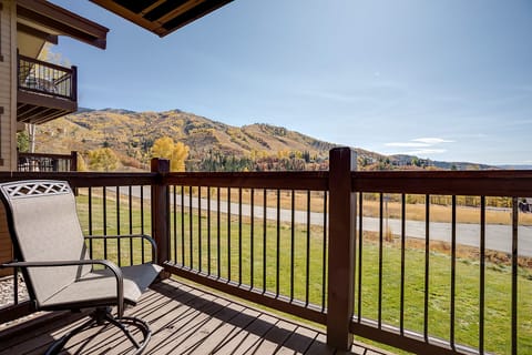 Breathtaking mountain views await you from your private balcony, where golden autumn colors paint the landscape beyond.