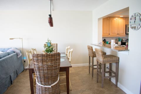 Dining room table seats 6 with 2 additional seats at the bar.