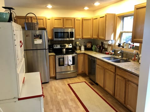 Open kitchen with all the gadgets you'll need for both cooking & baking.
