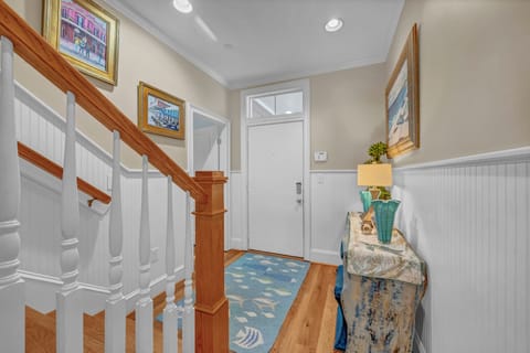 Step into your welcoming entryway, where coastal charm meets home comfort. Warm wood accents and thoughtful décor set the tone for your relaxing stay.