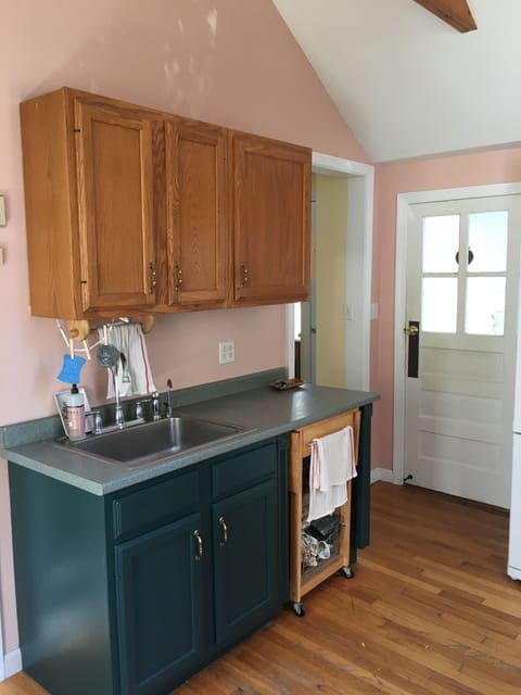 Cart pictured under counter can be pulled out and used for more counter space.