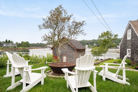Outdoor firepit area for guest use - the perfect spot to unwind after a long day of exploring the harbor
