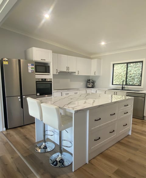 Holiday Home, Pets Not Allowed | Private kitchen | Full-size fridge, microwave, toaster, cookware/dishes/utensils
