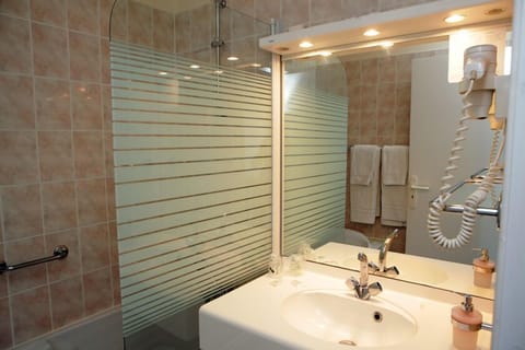 Shower, free toiletries, hair dryer, slippers