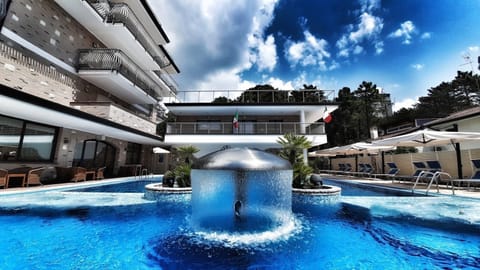 Outdoor pool, open 8:00 AM to midnight, pool umbrellas, sun loungers