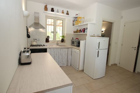 Cook delicious food in the villa kitchen with full size oven, micro., dishwasher