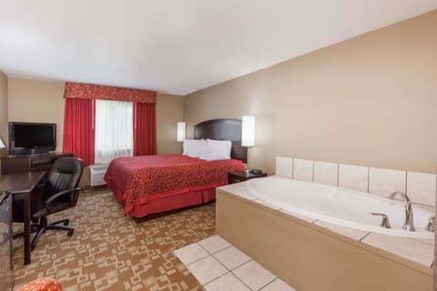Suite, 1 King Bed, Jetted Tub | Premium bedding, desk, iron/ironing board, rollaway beds