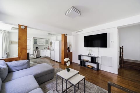 Family Apartment, 2 Bedrooms, Kitchen | Living area | 65-inch Smart TV with digital channels, TV