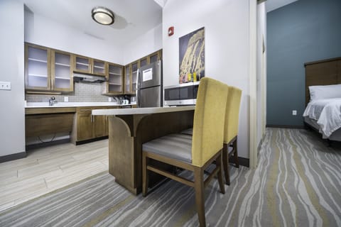 Premium bedding, desk, laptop workspace, blackout drapes