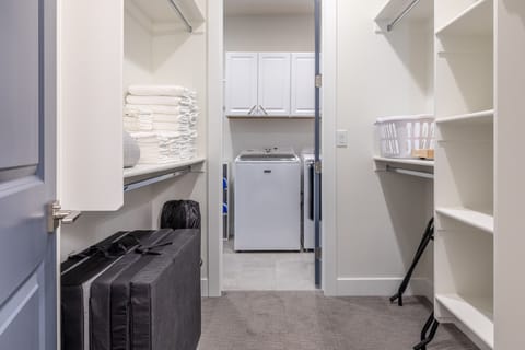 Main Closet - This master closet has plenty of room for your luggage. You will also find a pack-n- play available.