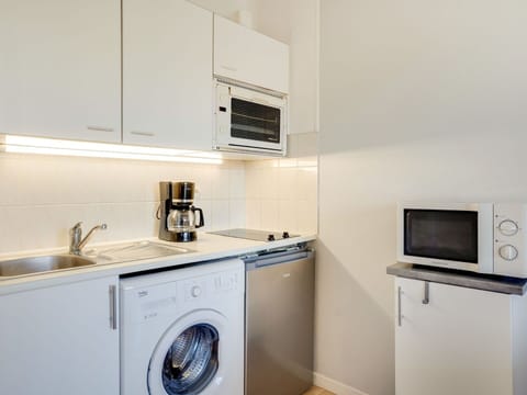 Cabinetry, Property, Kitchen Sink, Kitchen Appliance, Sink, Home Appliance, Kitchen, Clothes Dryer, Kitchen Stove, Interior Design