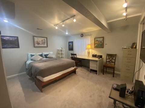 Spacious bedroom with Queen Bed and bathroom,  Kitchenette.and Large Work Table.