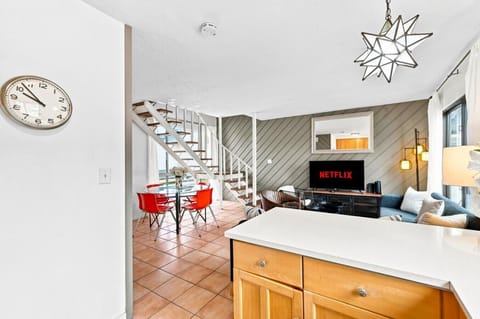 Bright open-concept layout ✨ Soaring high ceilings, modern lounge area, and Netflix-ready Smart TV.