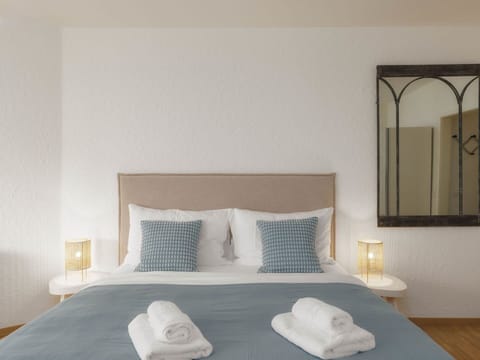 Furniture, Interior Design, Bed, Bedroom, Wall, Floor, Bedding, Wood, Room, Linens
