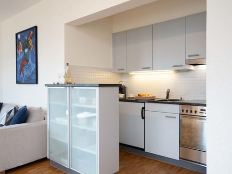 Furniture, Interior Design, Kitchen, Flooring, Cabinetry, Kitchen Appliance, Countertop, Floor, Major Appliance, Wood