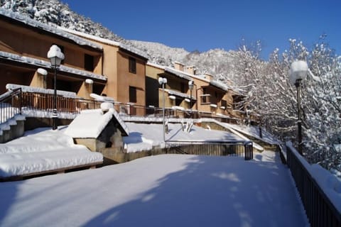 Charming snow-covered path leading to the heart of Les Gorges Rouges residence.