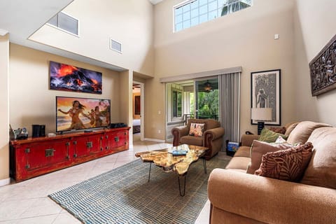 Open Living Area: Comfortable seating, large windows for natural light, and easy access to the lanai