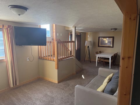 Basic Apartment, City View | Living area | Flat-screen TV