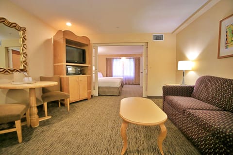 Two Bedroom Suite | Living area | 37-inch flat-screen TV with cable channels, TV
