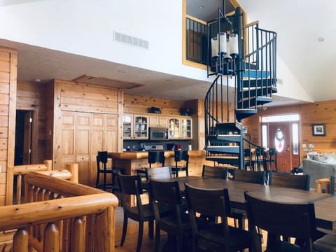 Overview of dining area and spiral staircase
