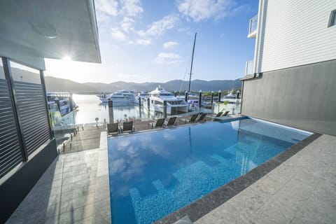 Outdoor pool, a heated pool, open 6:00 AM to 10:00 PM, sun loungers