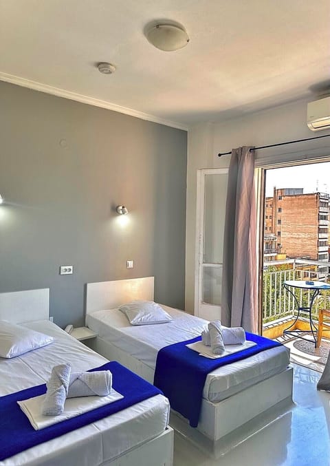 Standard Double or Twin Room, Shared Bathroom | Blackout drapes, iron/ironing board, free WiFi, bed sheets