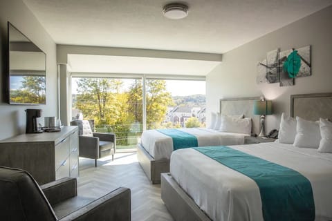 Luxurious Room w/ Two Queen Beds, 65'' TV, Complimentary Drinks - Non-smoking | Egyptian cotton sheets, premium bedding, down comforters, pillowtop beds