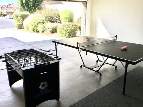 Ping pong and Foosball table in garage