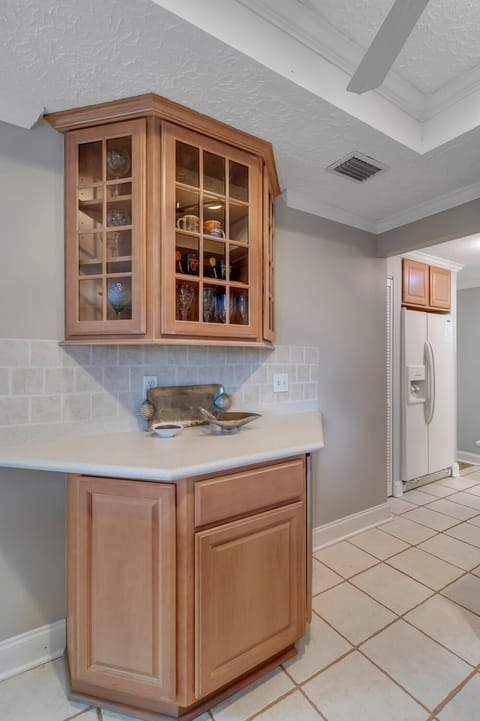 - Serve drinks or prep snacks on this handy corner counter with glass display storage
- Upper cabinet showcases colorful glasses while lower drawers add function
- Thoughtful touch that keeps everything stylish and within reach
