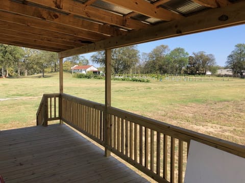 view from wraparound porch toward Indian mound, vineyard and commissary
