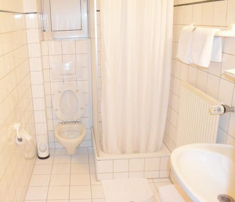 Shower, hair dryer, towels, toilet paper