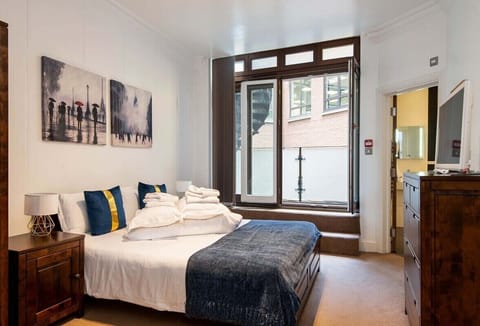 Large Bedroom with doors to Balcony