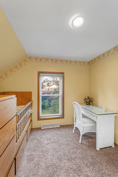 Crib, baby changing station and desk. 