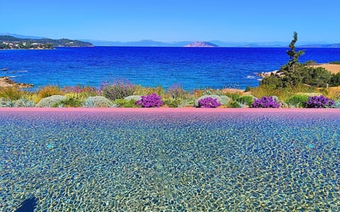 The pool meets the sea, creating a peaceful,endless view of blue and tranquility