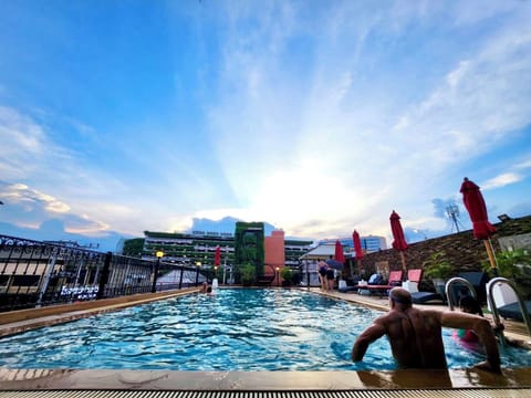 Outdoor pool, open 10:00 AM to 6:00 PM, pool umbrellas, sun loungers