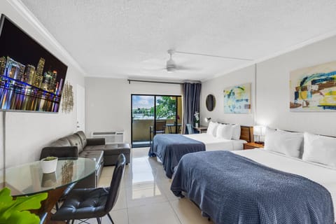 Superior Double Queen W/ Balcony & Sofa | Premium bedding, in-room safe, blackout drapes, iron/ironing board