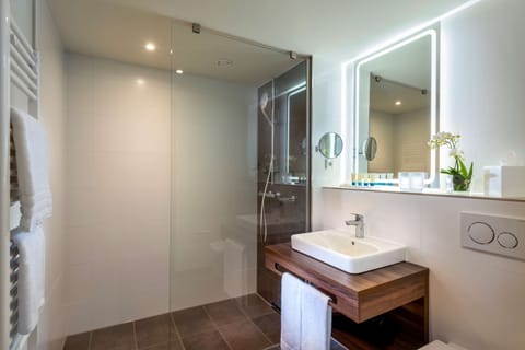 Shower, rainfall showerhead, hair dryer, towels