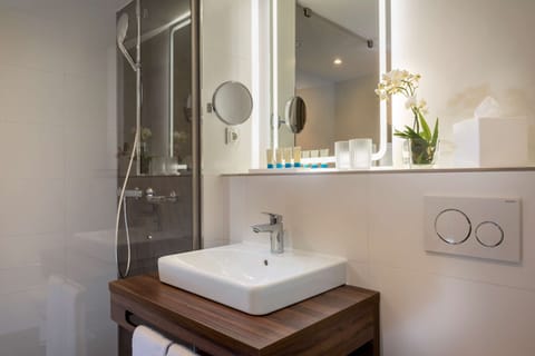 Shower, rainfall showerhead, hair dryer, towels