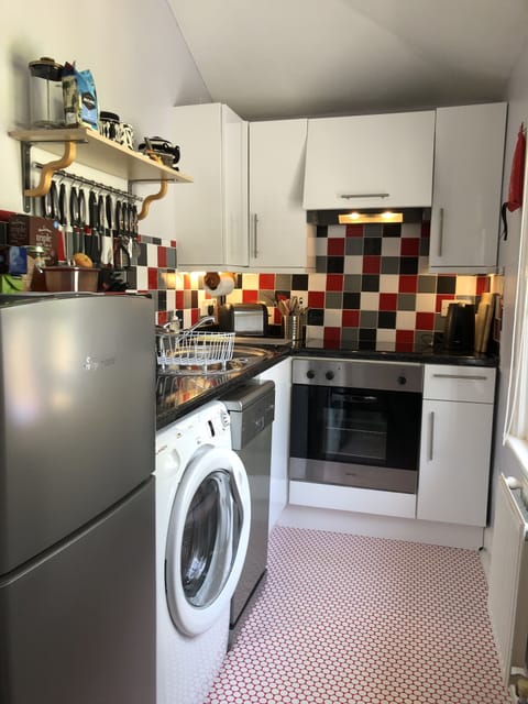 Fully fitted kitchen with oven, hob, microwave, washing machine and dishwasher 