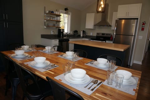 Open concept dining room and kitchen for meals shared with family and friends
