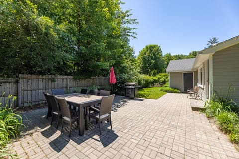 Very private “magical” backyard with dining table, lawn games, and party lights